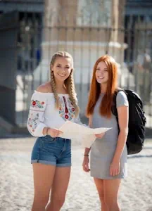 Young travelers planning their trip with a map.